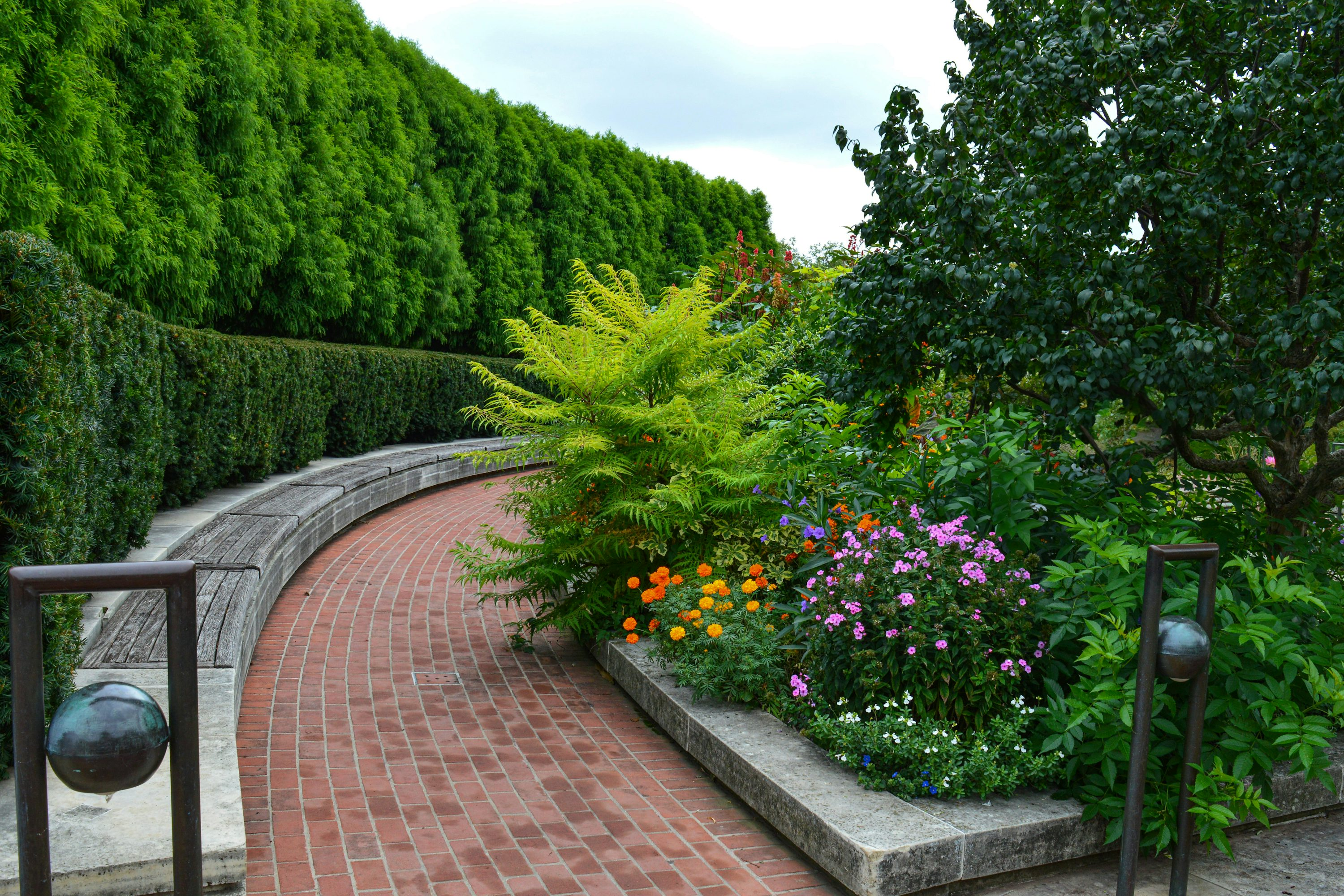brick road with flowers on the side